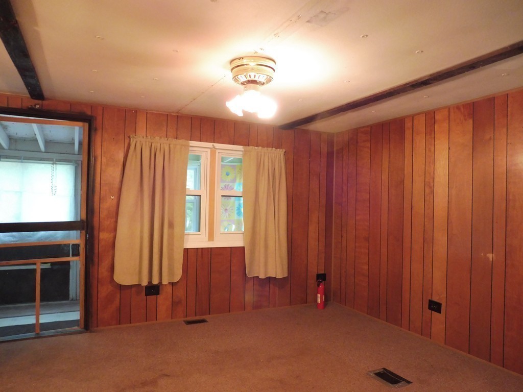 145 Holt Road Ashburnham, MA 01430 - Photo 5 of 13 an empty room with windows