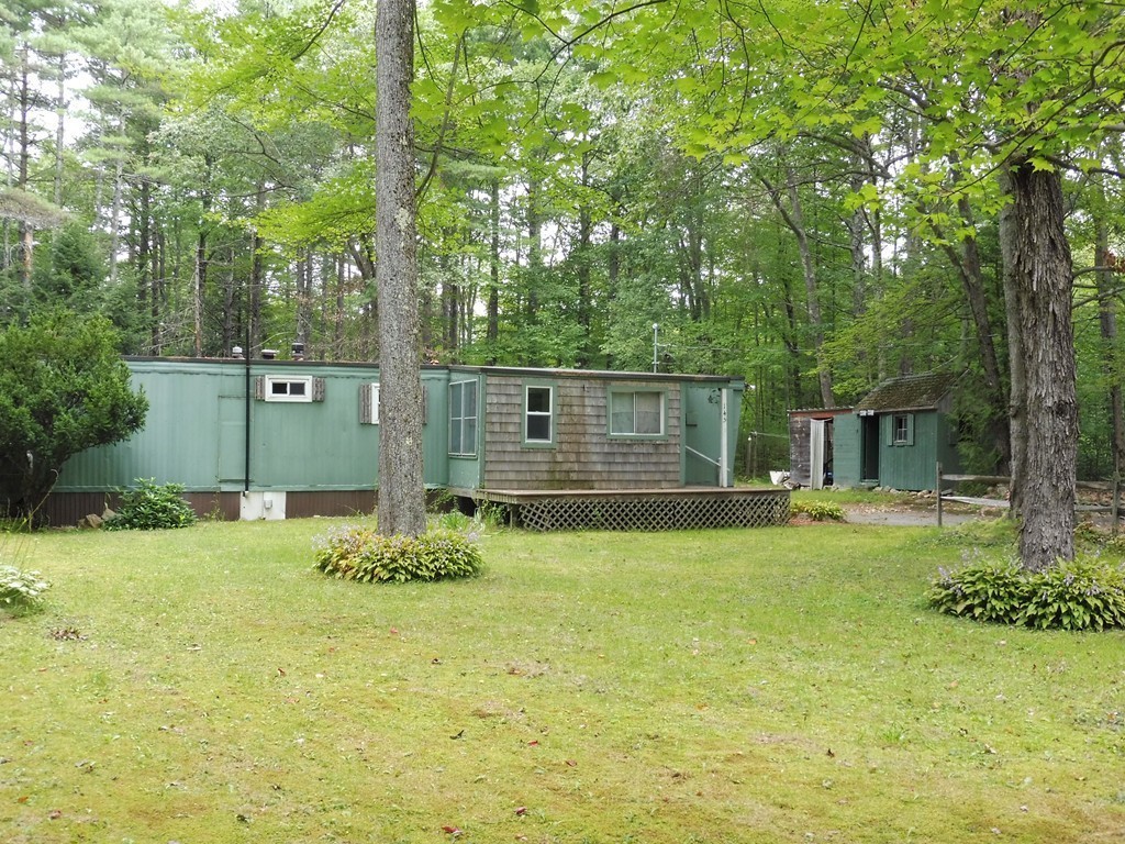 145 Holt Road Ashburnham, MA 01430 - Photo 10 of 13 a backyard of a house with yard and outdoor seating