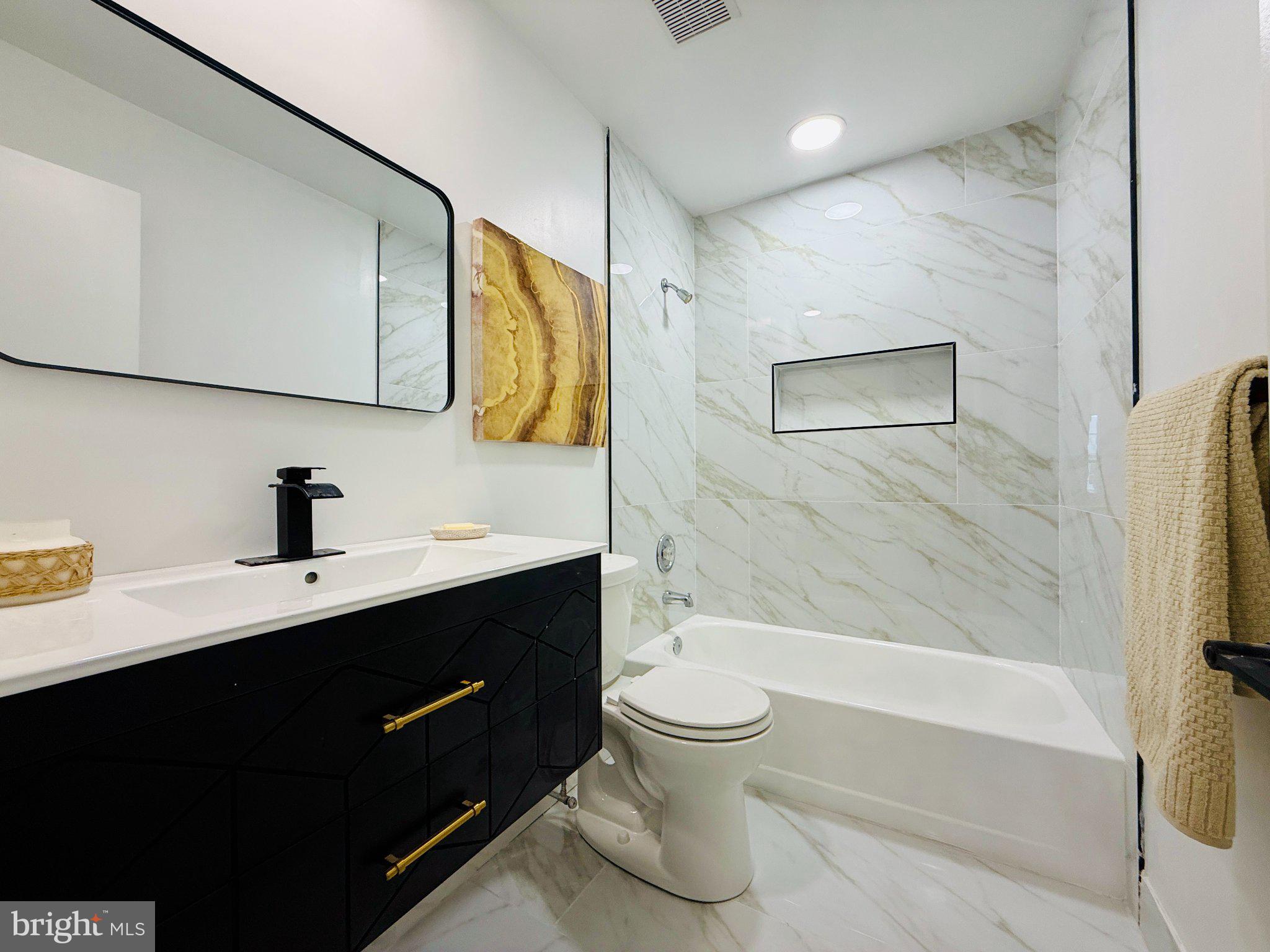 815 Whitehall Street Silver Spring, MD 20901 - Photo 26 of 39 Sleek modern bathroom with elegant finishes.