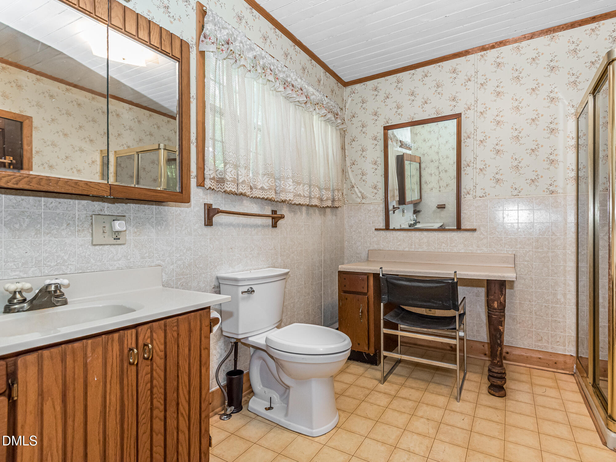381 Royal Road Roseboro, NC 28382 - Photo 24 of 30 a bathroom with a toilet a sink and a window