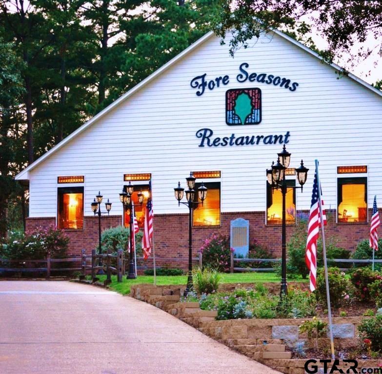 316-317 Brazos Bend Holly Lake Ranch, TX 75765 - Photo 22 of 26 a front view of a house with yard and garage