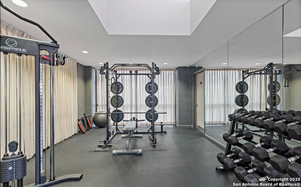 7701 Wurzbach Road, Unit 1205 San Antonio, TX 78229 - Photo 15 of 38 a view of a room with gym equipment