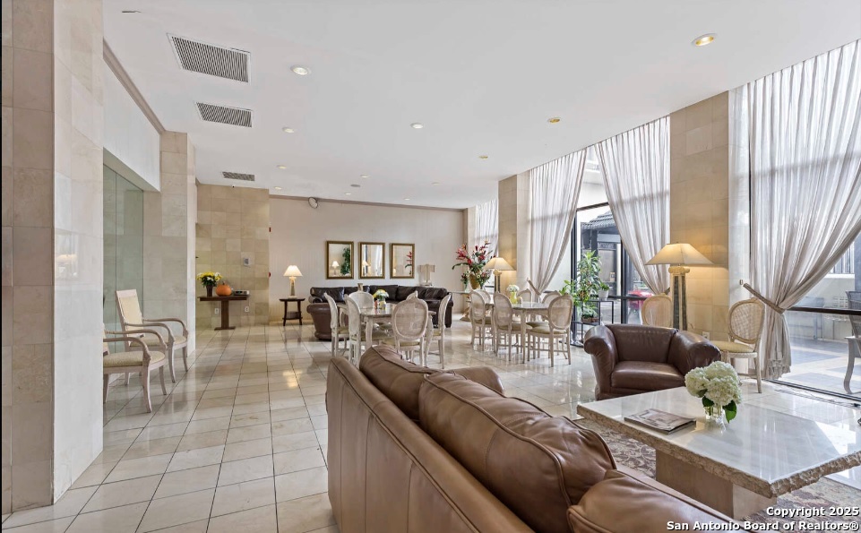 7701 Wurzbach Road, Unit 1205 San Antonio, TX 78229 - Photo 37 of 38 a living room with furniture and a large window