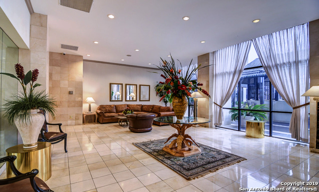 7701 Wurzbach Road, Unit 1205 San Antonio, TX 78229 - Photo 10 of 38 a living room with patio furniture