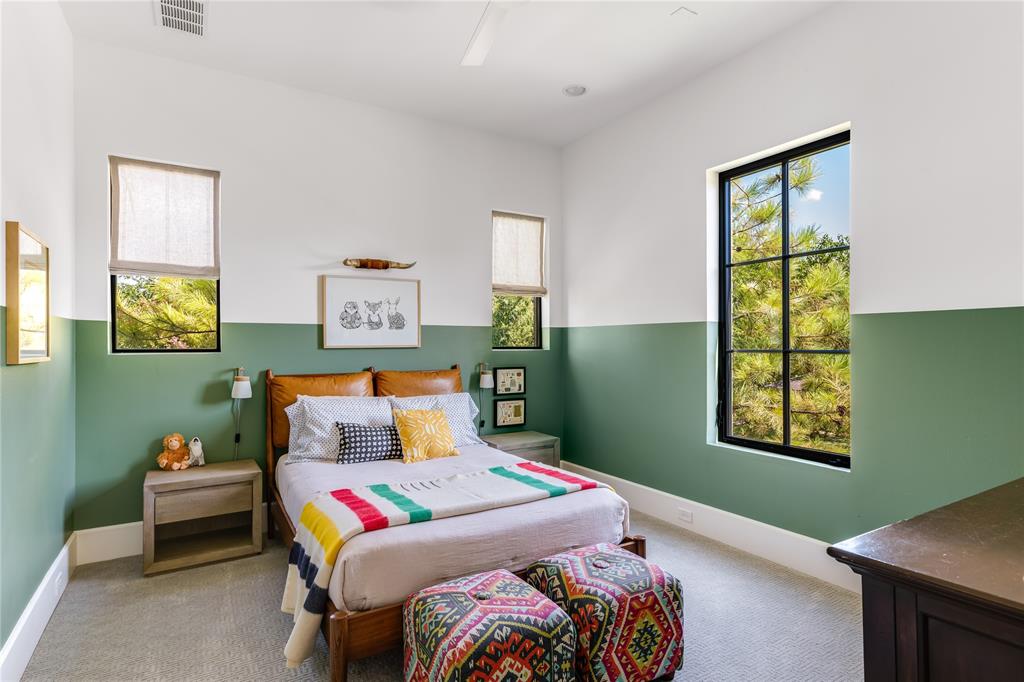 6905 Northridge Drive Dallas, TX 75214 - Photo 21 of 35 a bedroom with a bed and a window