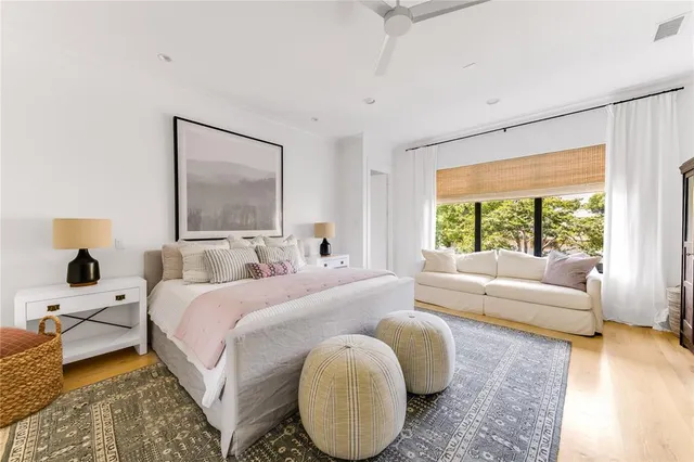 a bedroom with a large bed and a couch