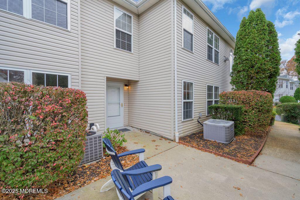 357 Volley Court Wall, NJ 07719 - Photo 2 of 19 a backyard of a house with outdoor seating