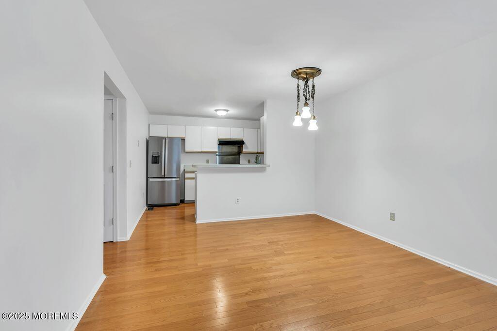 357 Volley Court Wall, NJ 07719 - Photo 7 of 19 a view of a kitchen with a sink and cabinet