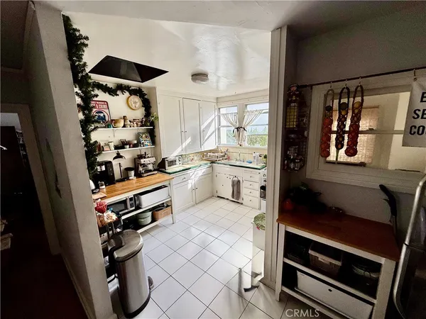 a kitchen with stainless steel appliances a stove a sink and a refrigerator