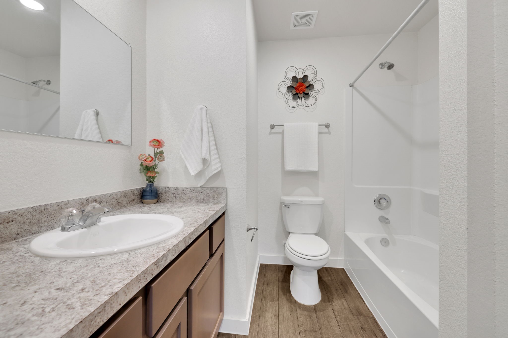 12603 Telge Road, Unit 30CD Cypress, TX 77429 - Photo 13 of 22 a bathroom with a granite countertop sink a toilet and a bathtub