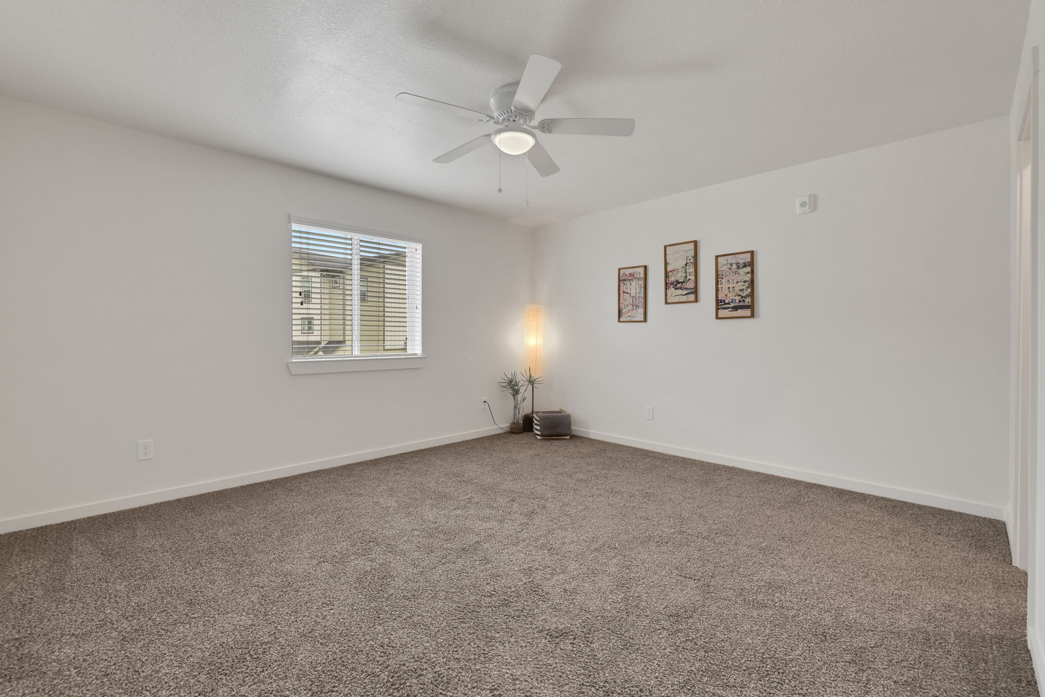 12603 Telge Road, Unit 30CD Cypress, TX 77429 - Photo 15 of 22 an empty room with ceiling fan and window