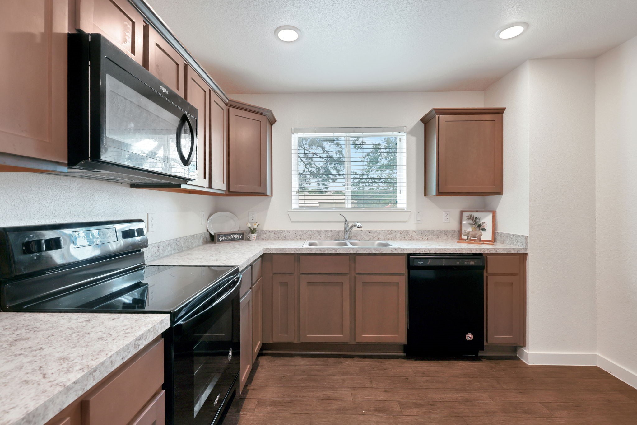 12603 Telge Road, Unit 30CD Cypress, TX 77429 - Photo 7 of 22 a kitchen with stainless steel appliances granite countertop a sink stove and oven