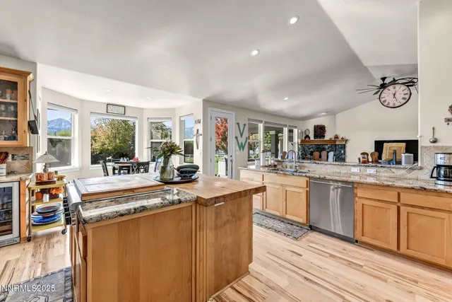 a kitchen with stainless steel appliances granite countertop a stove and a refrigerator