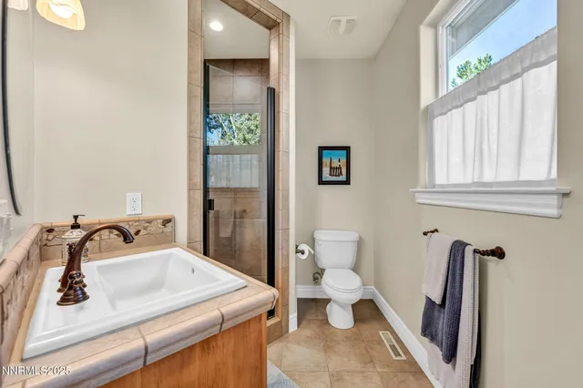 a bedroom with bed and a window