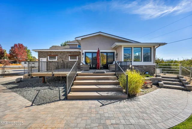 a bedroom with furniture and a flat screen tv
