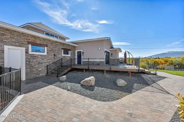 a kitchen with kitchen island granite countertop a refrigerator a stove a sink and a refrigerator