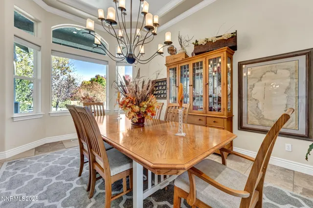 a living room with furniture potted plant and a table