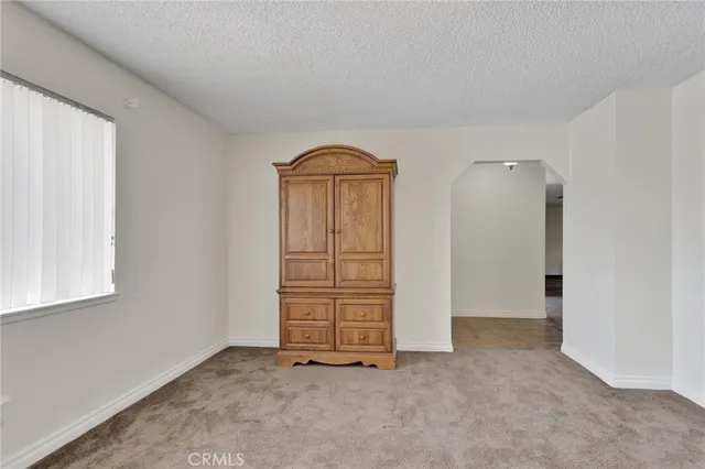 an empty room with closet area