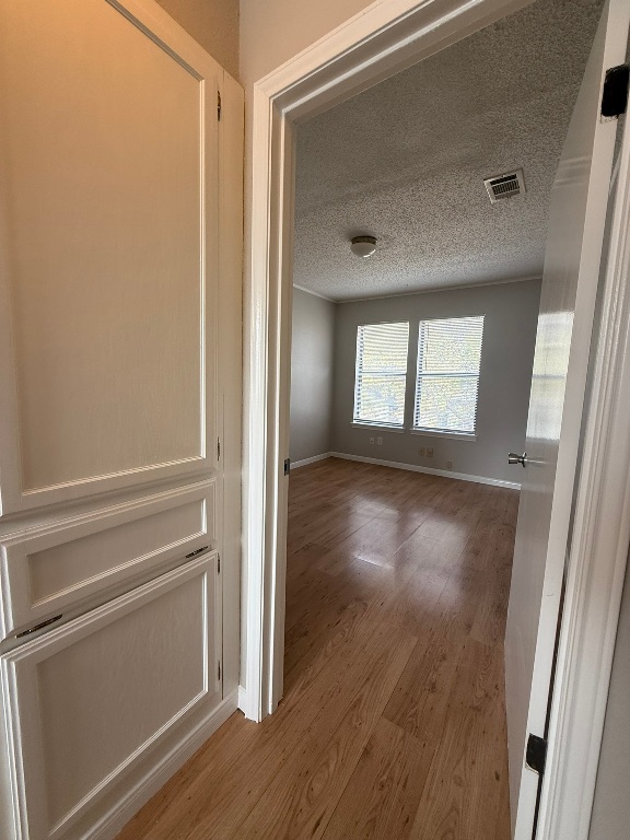 7806 Topawa Cove, Unit A Austin, TX 78729 - Photo 17 of 25 a view of empty room with window and wooden floor