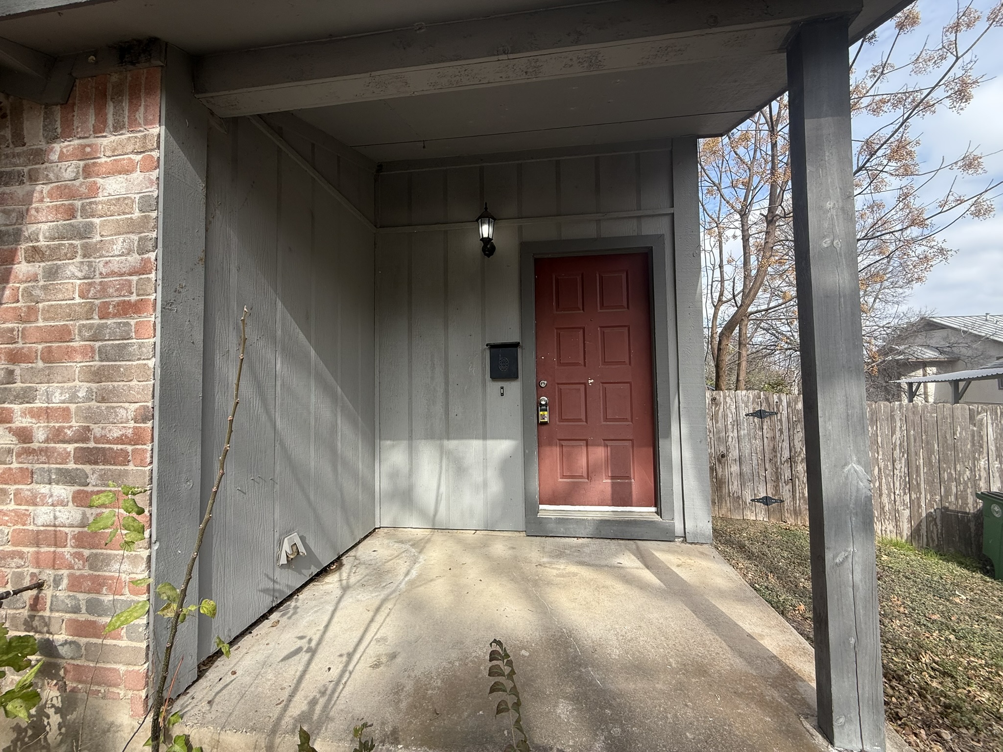 7806 Topawa Cove, Unit A Austin, TX 78729 - Photo 2 of 25 Property entrance featuring brick siding