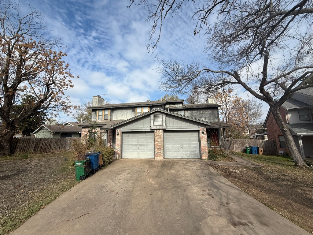 7806 Topawa Cove, Unit A Austin, TX 78729 - Photo 3 of 25 a house with trees in front of it