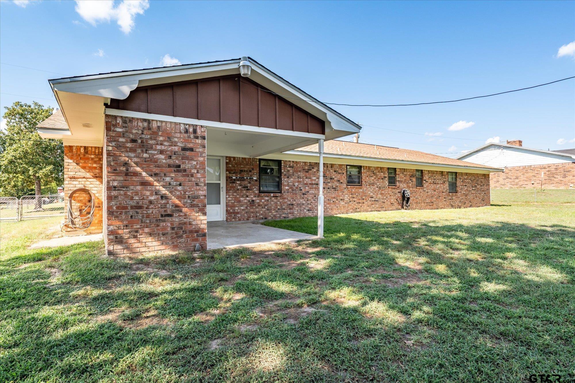 13791 Maple Drive Tyler, TX 75709 - Photo 24 of 26 a view of a house with a yard