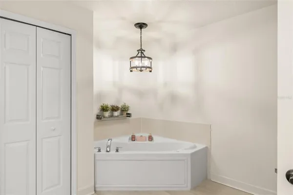 a en suite bathroom with a double vanity sink a mirror and shower