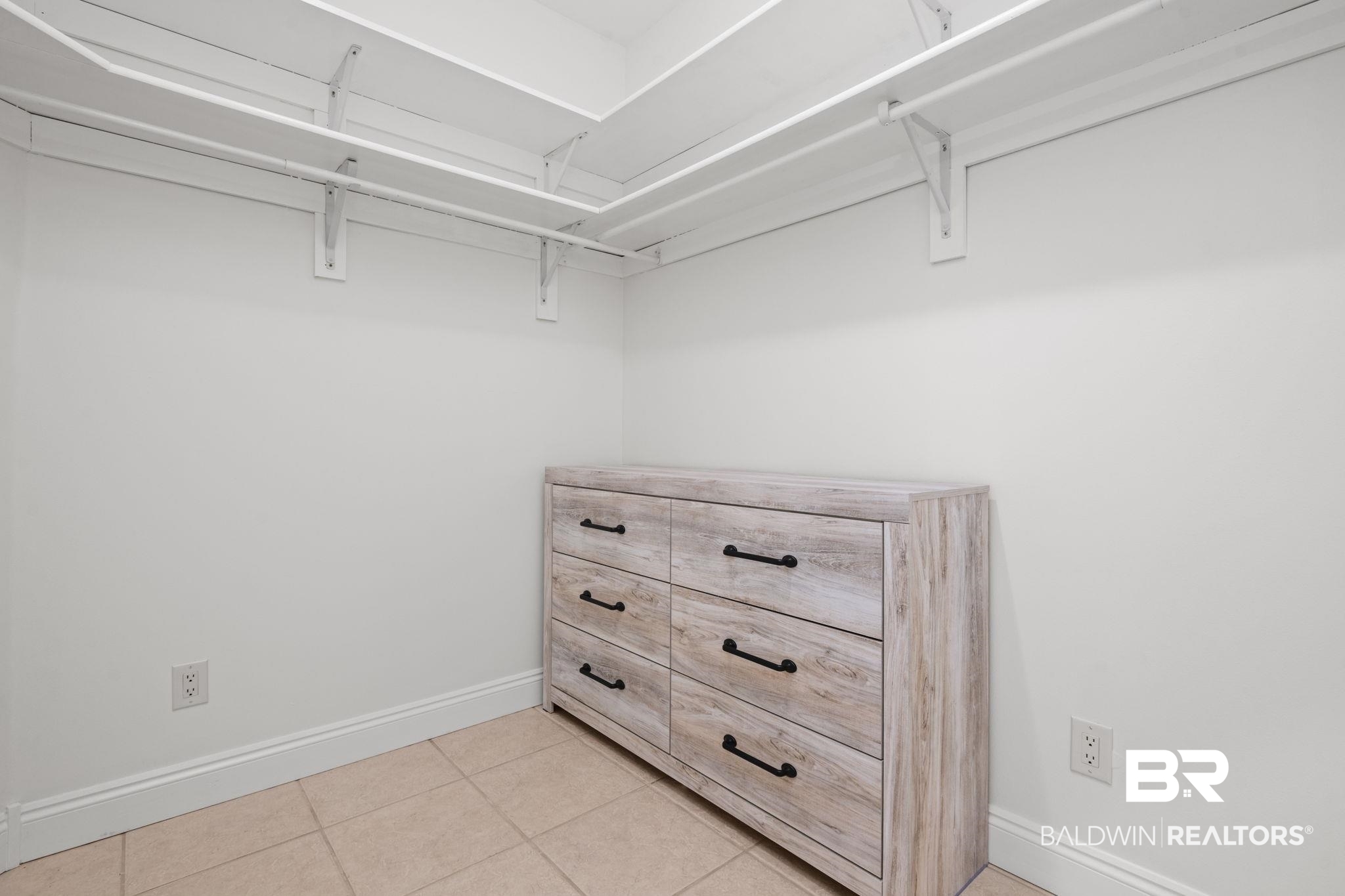 29634 St George Street Daphne, AL 36526 - Photo 30 of 47 Walk in closet featuring light tile patterned flooring