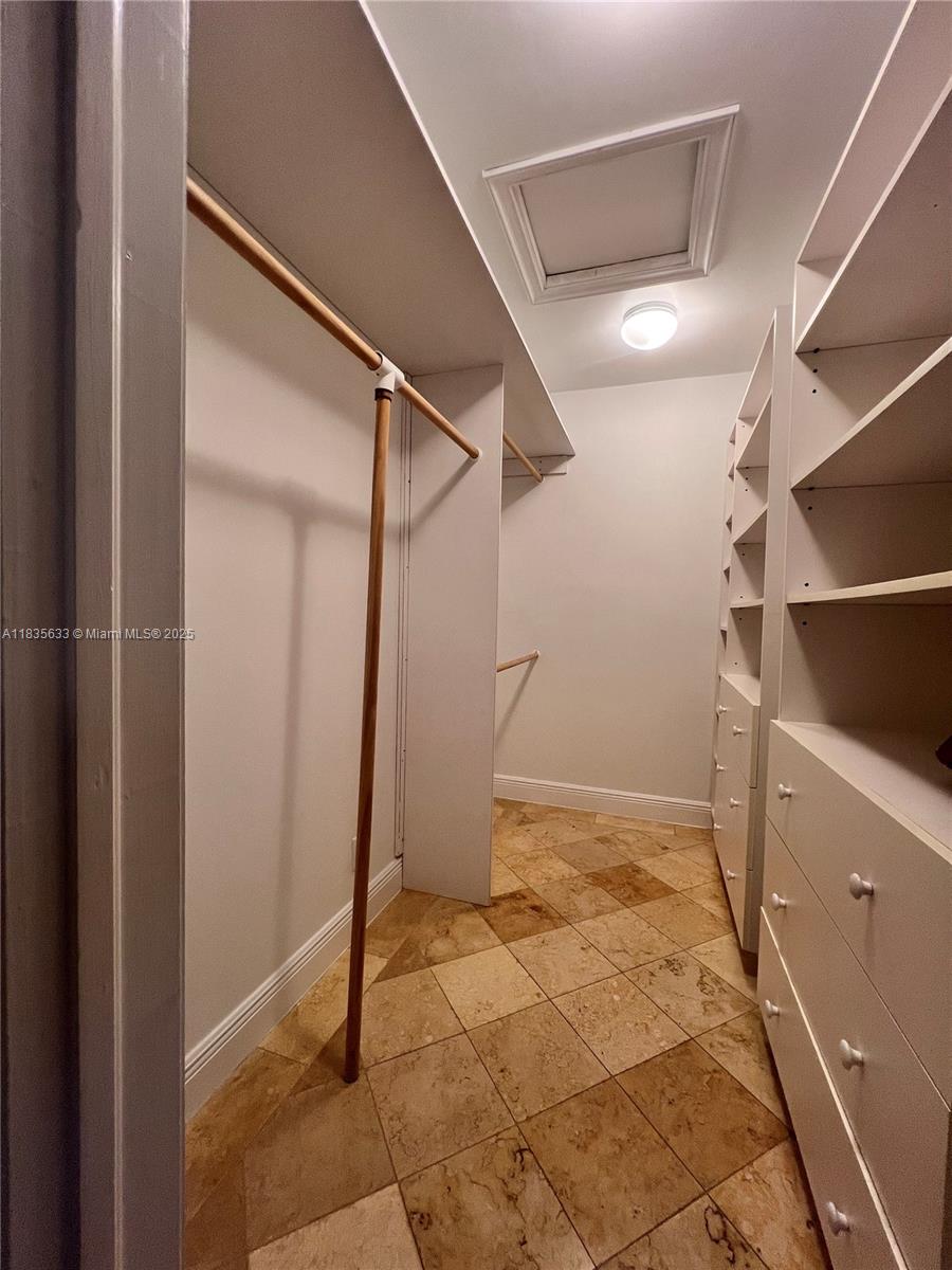 7350 Southwest 96th Street, Unit 7350 Pinecrest, FL 33156 - Photo 13 of 25 a view of an empty room