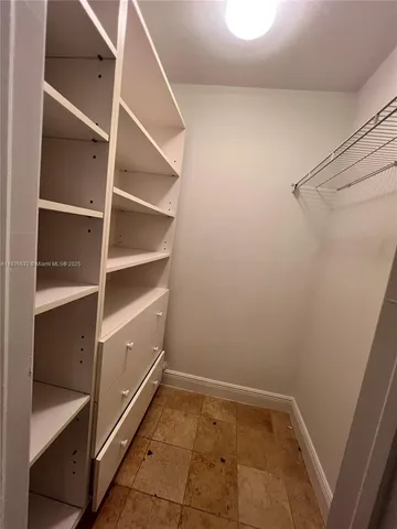 a view of an empty walk in closet