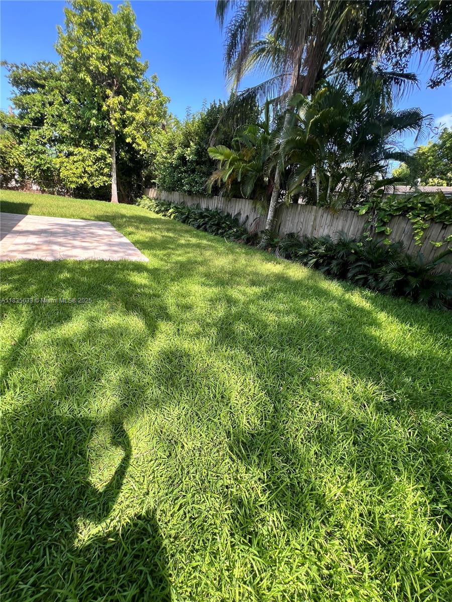 7350 Southwest 96th Street, Unit 7350 Pinecrest, FL 33156 - Photo 22 of 25 a view of yard with green space