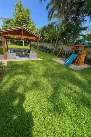 a view of a two chairs in the garden