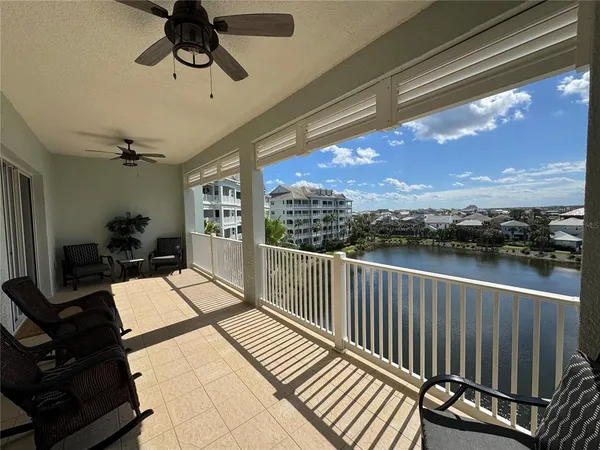 a view of balcony with furniture