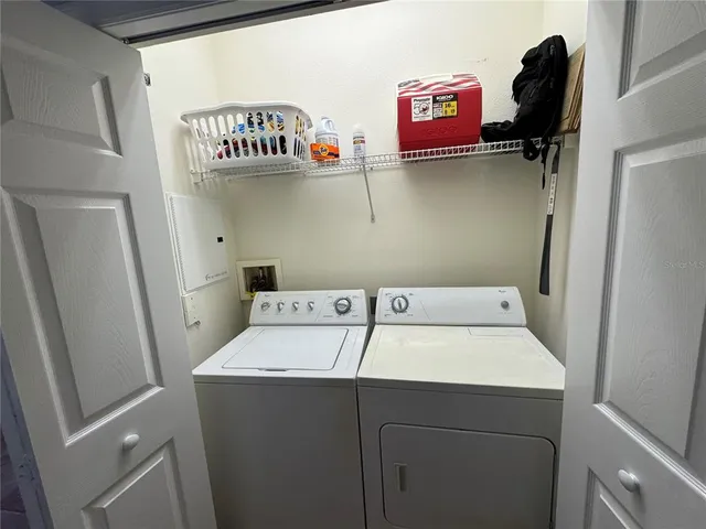 a utility room with dryer and washer