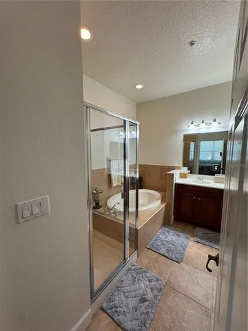 a living room with furniture and a glass door