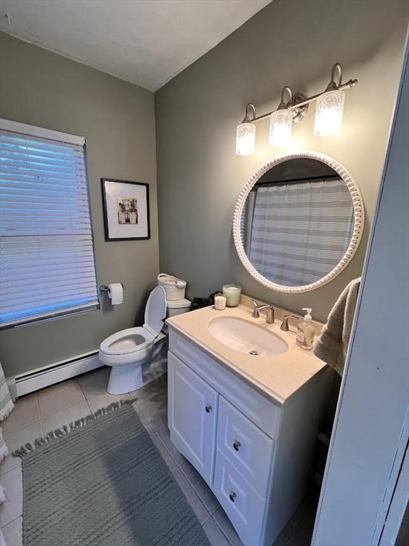 248 Greeley Street Clinton, MA 01510 - Photo 13 of 25 a bathroom with a sink mirror vanity and toilet