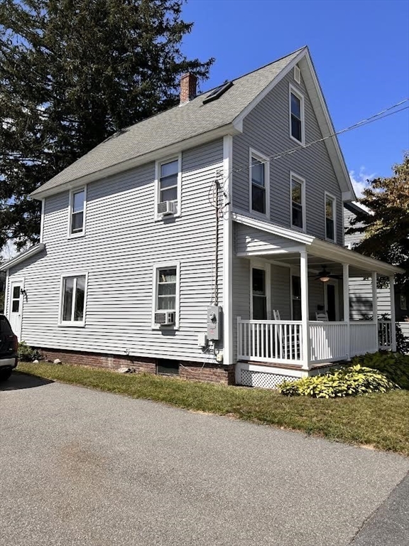 248 Greeley Street Clinton, MA 01510 - Photo 2 of 25 a front view of a house with a garden