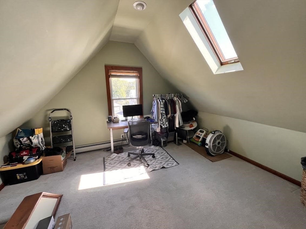 248 Greeley Street Clinton, MA 01510 - Photo 23 of 25 a view of a room with a baby crib and a window