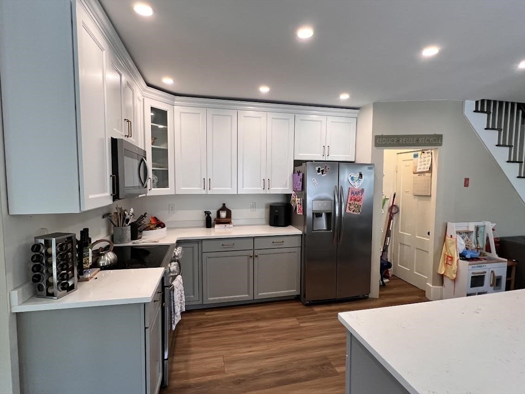 248 Greeley Street Clinton, MA 01510 - Photo 10 of 25 a kitchen with refrigerator and cabinets