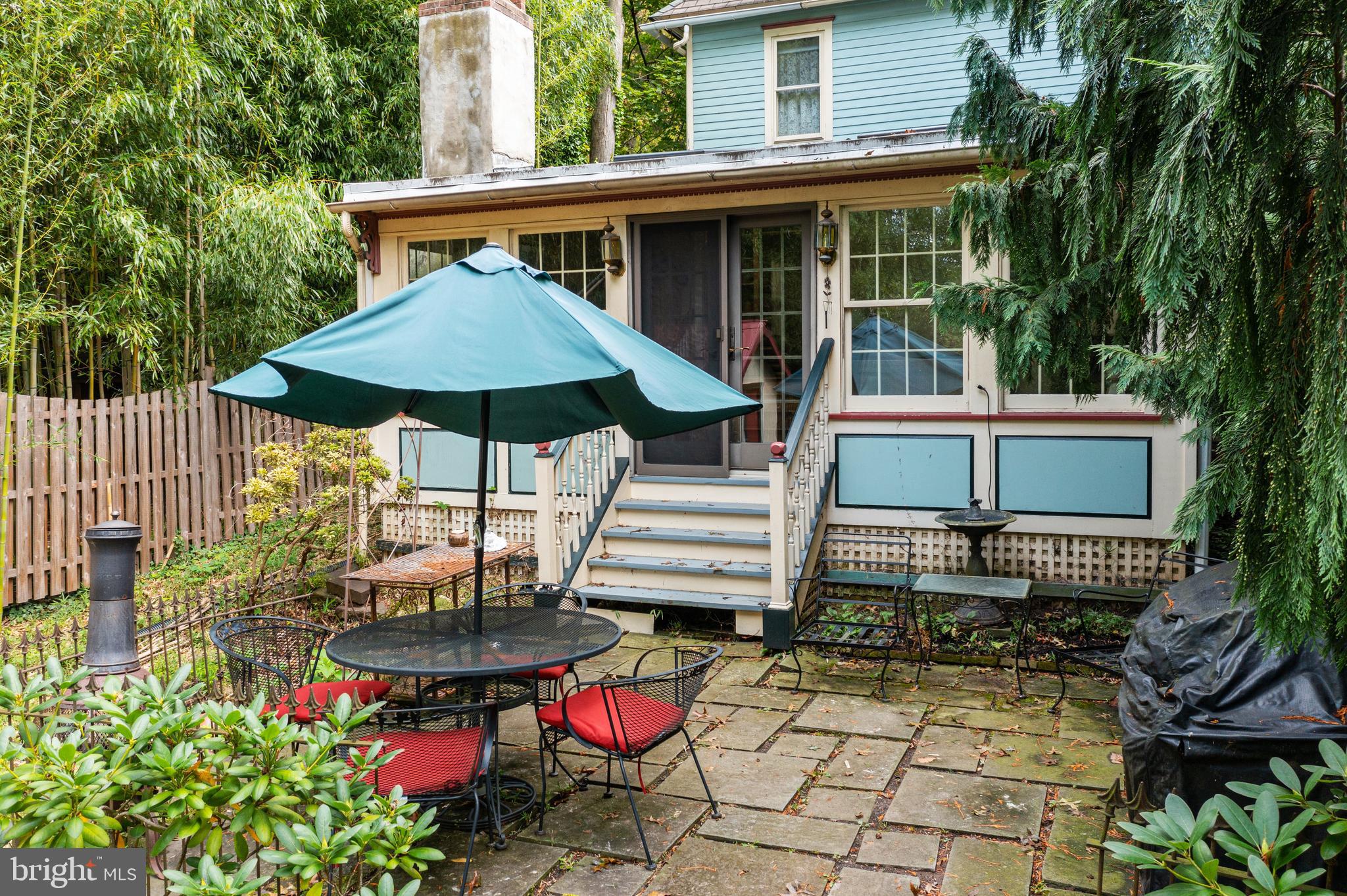 4140 Township Line Road Newtown, PA 18940 - Photo 11 of 41 a backyard of a house with table and chairs