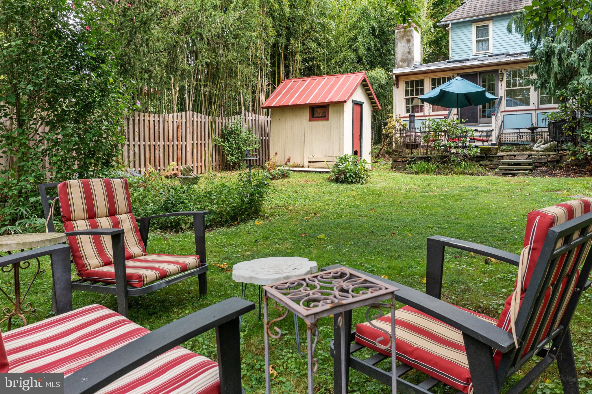 4140 Township Line Road Newtown, PA 18940 - Photo 13 of 41 a view of a chairs and table in backyard of the house