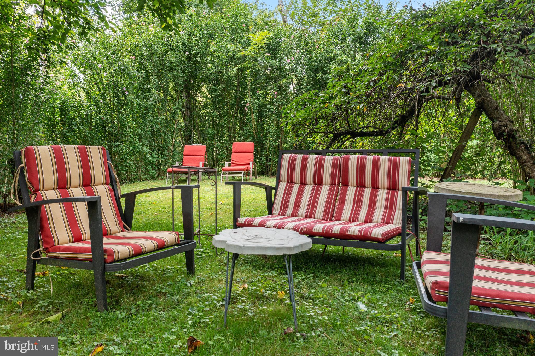 4140 Township Line Road Newtown, PA 18940 - Photo 14 of 41 a backyard of a house with table and chairs
