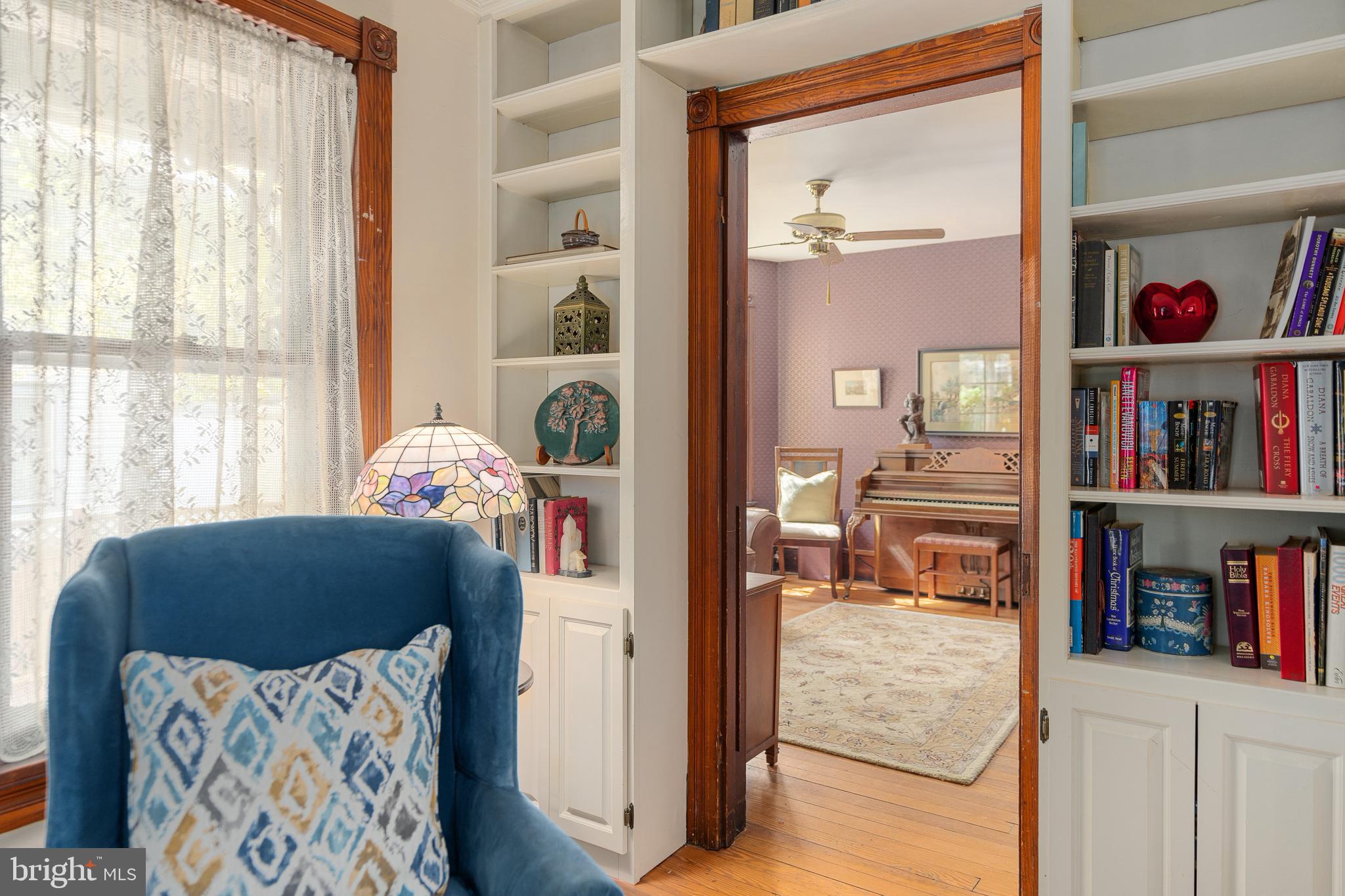 4140 Township Line Road Newtown, PA 18940 - Photo 19 of 41 a living room with furniture and a book shelf