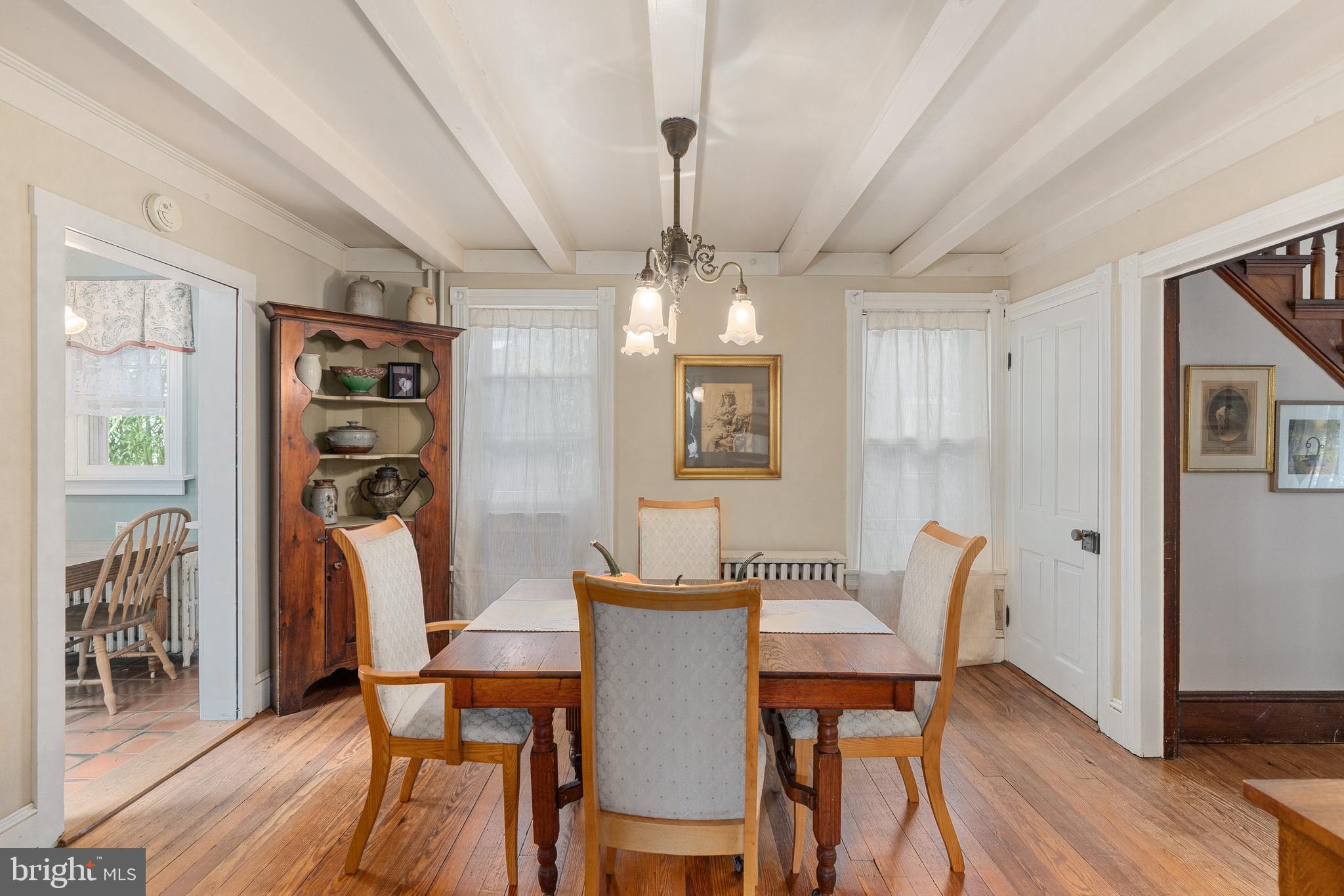 4140 Township Line Road Newtown, PA 18940 - Photo 23 of 41 a view of a dining room with furniture window and wooden floor
