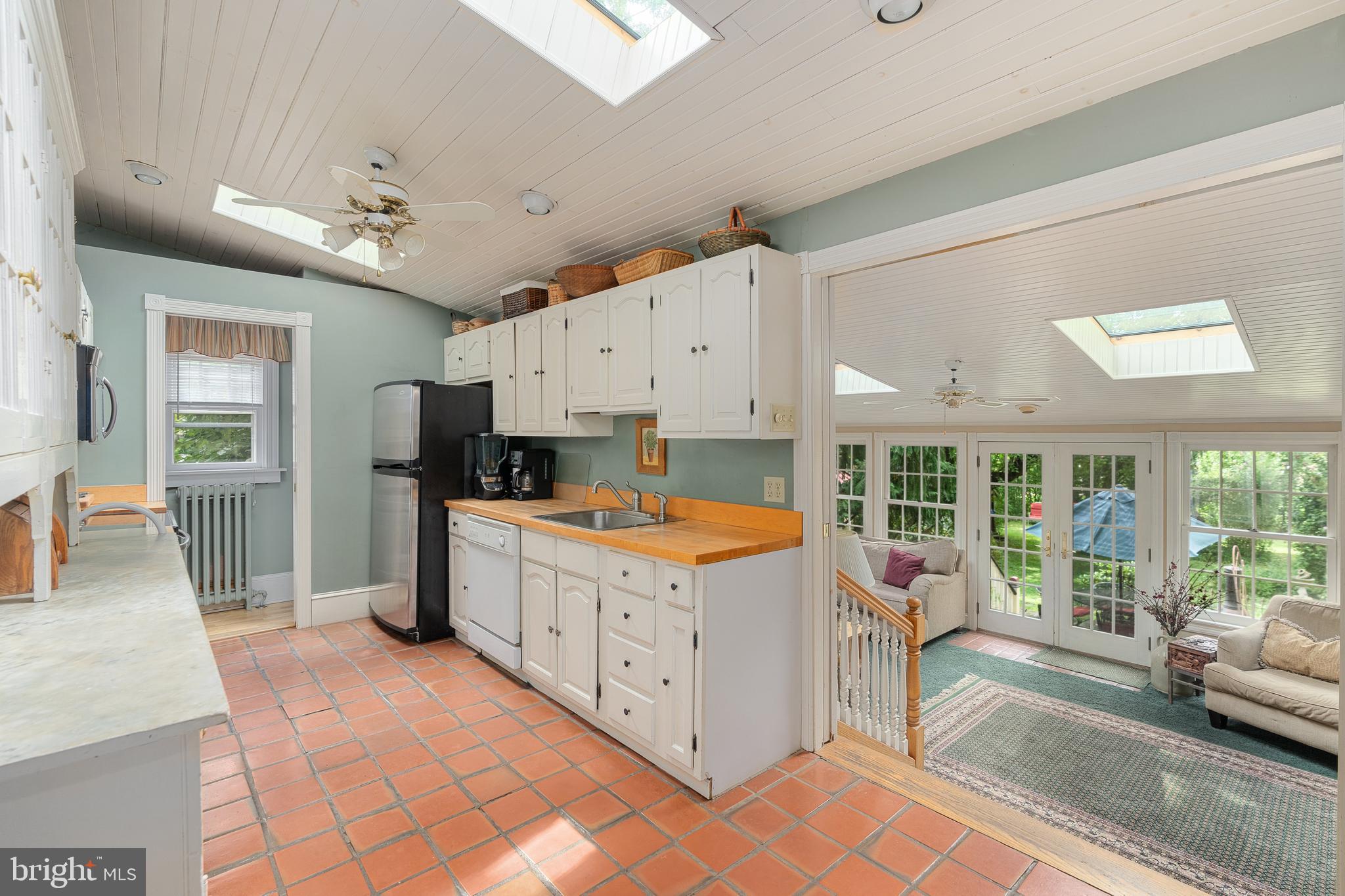4140 Township Line Road Newtown, PA 18940 - Photo 28 of 41 a kitchen that has a lot of white cabinets and stainless steel appliances