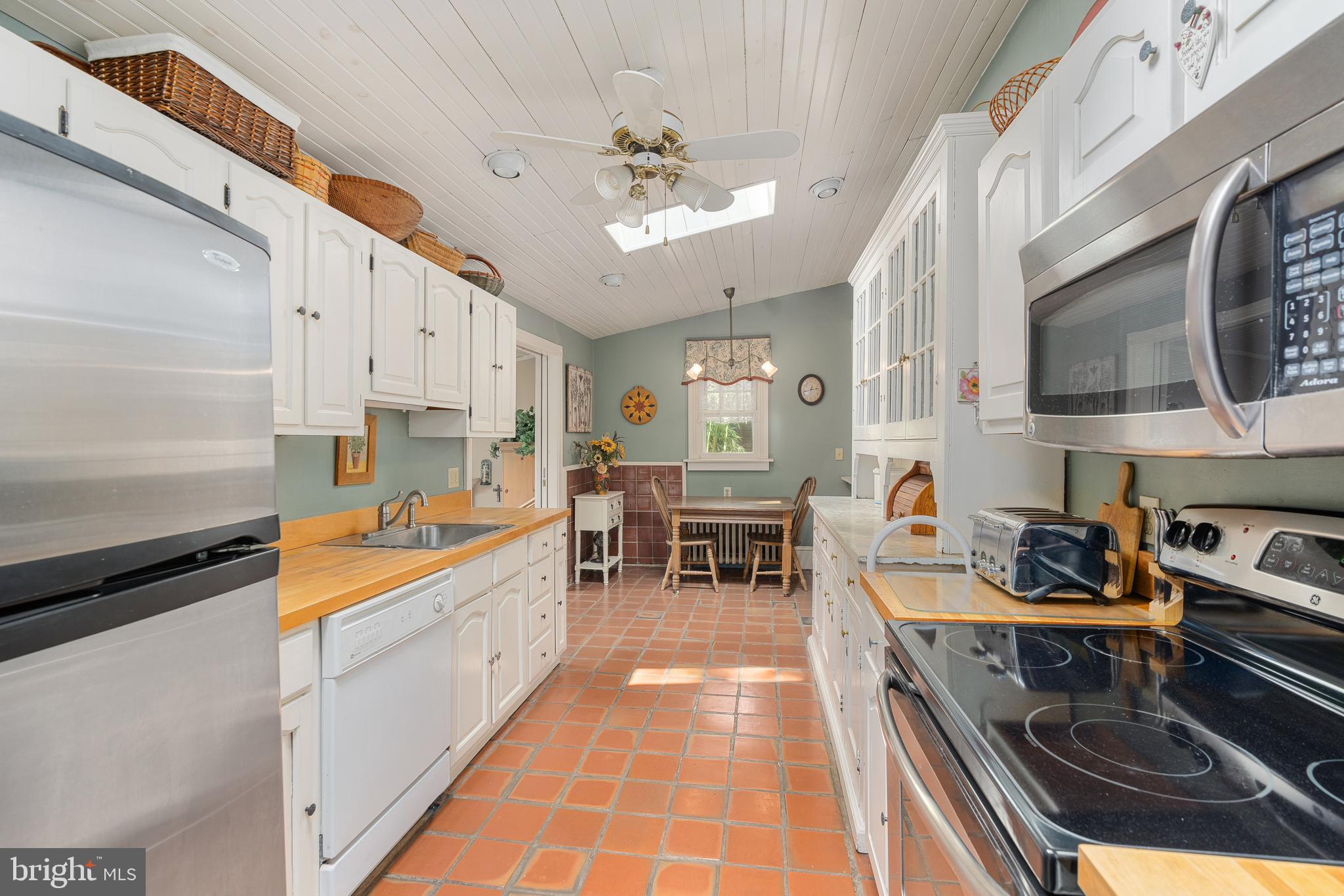 4140 Township Line Road Newtown, PA 18940 - Photo 30 of 41 a kitchen with stainless steel appliances granite countertop a sink and cabinets