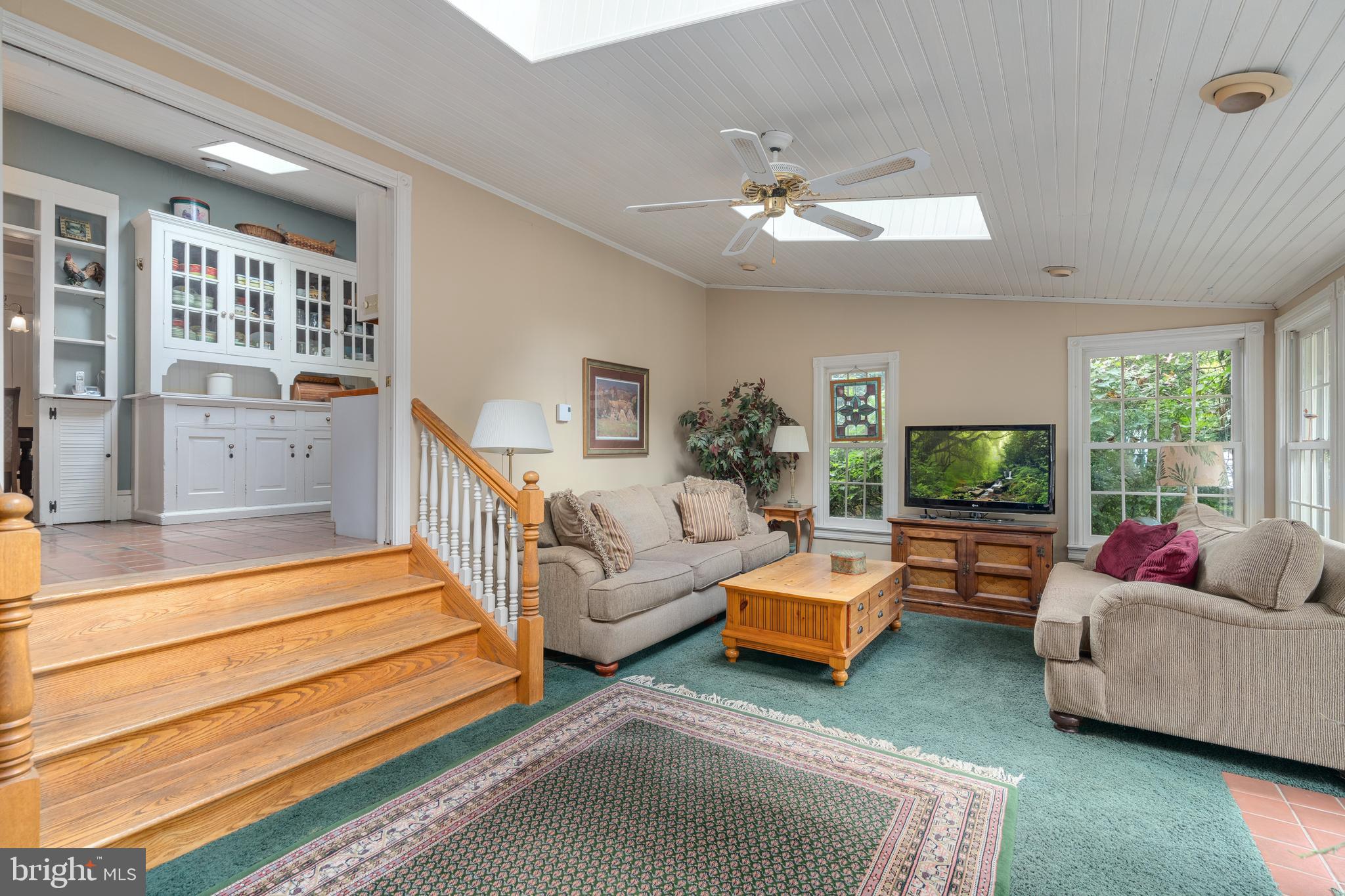 4140 Township Line Road Newtown, PA 18940 - Photo 32 of 41 a living room with furniture and a flat screen tv