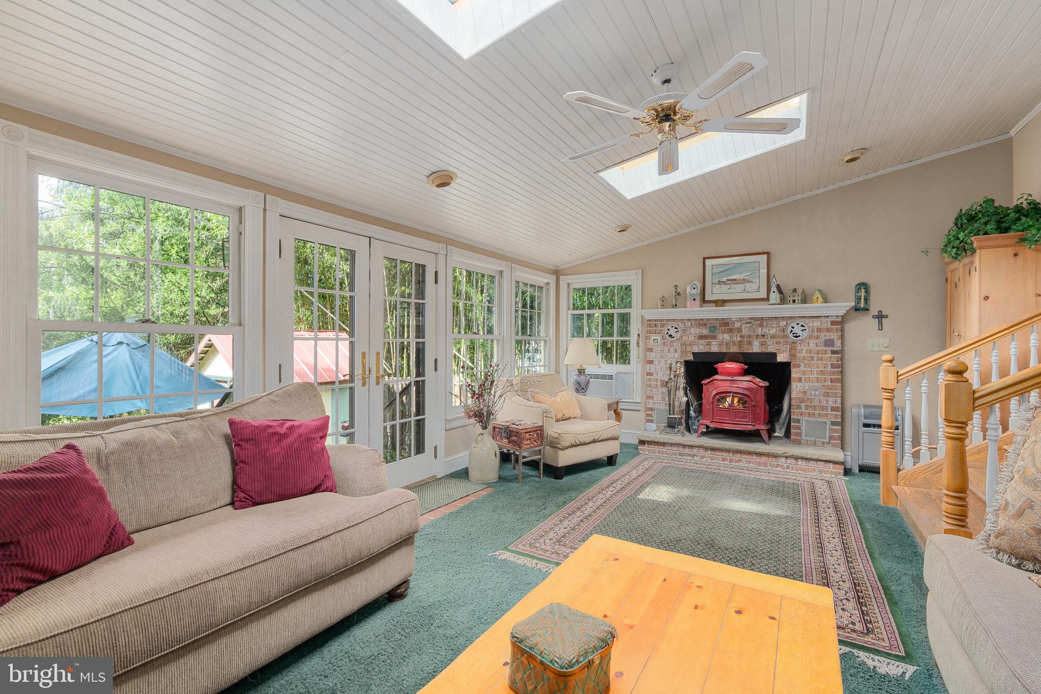 4140 Township Line Road Newtown, PA 18940 - Photo 33 of 41 a living room with furniture and a fireplace