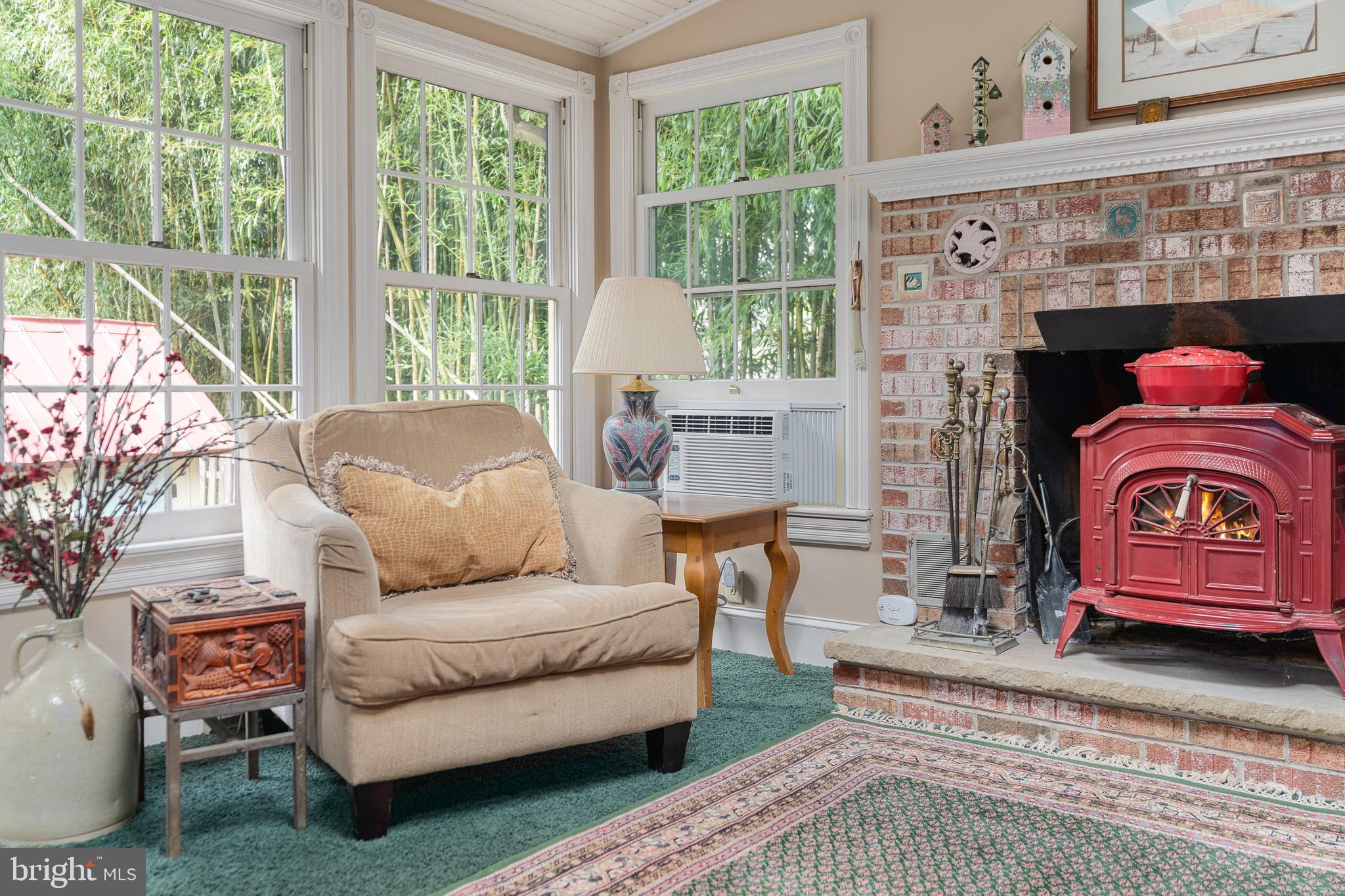 4140 Township Line Road Newtown, PA 18940 - Photo 34 of 41 a living room with furniture and a fireplace
