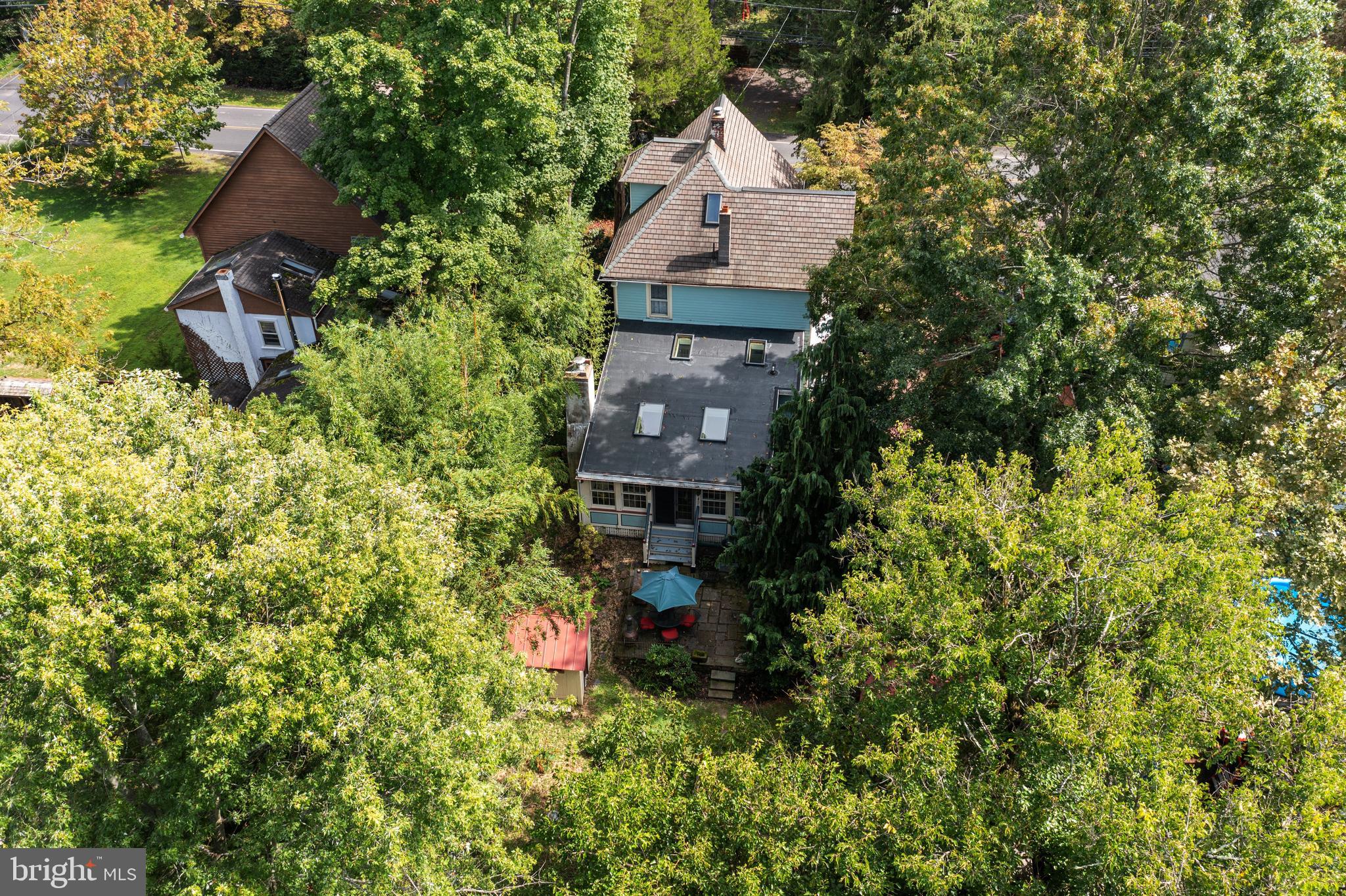 4140 Township Line Road Newtown, PA 18940 - Photo 8 of 41 an aerial view of a house with yard and outdoor seating
